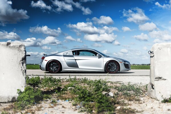 Silver Audi R8 in profile with steel discs