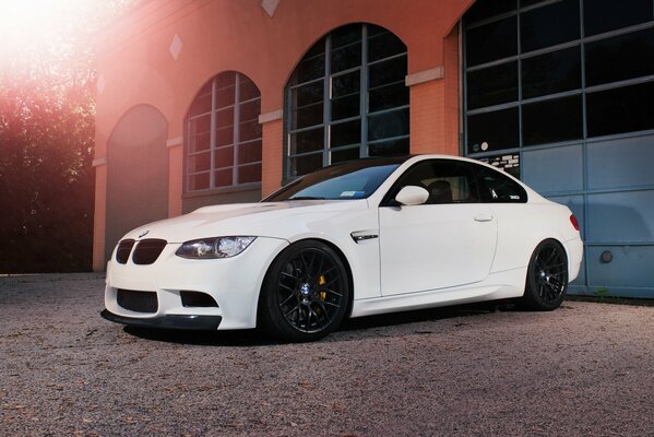 Beautiful white BMW car on the background of panoramic windows