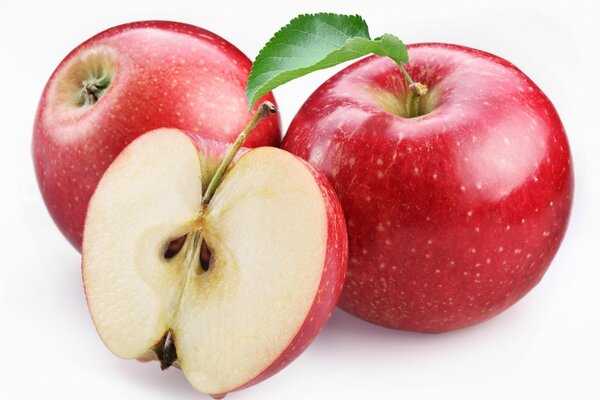 Three red apples on a white background