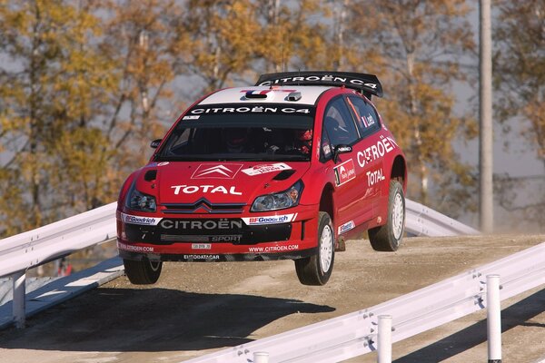 Red, racing car in the air