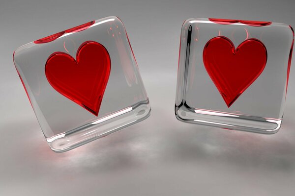 Red flaming hearts in transparent cubes