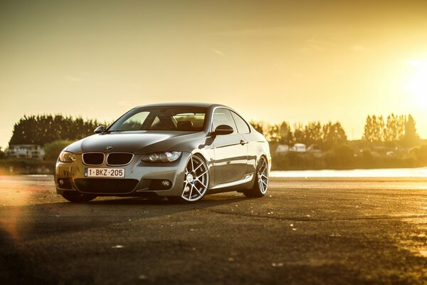 Grey BMW at golden sunset