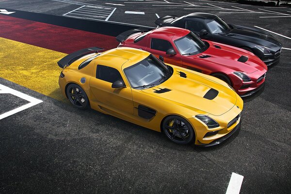 Sports car race on the background of the German flag