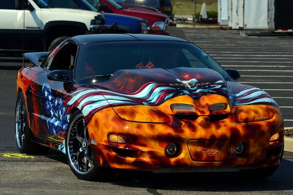 Pontiac trans am sports car with airbrushing and stylish wheels