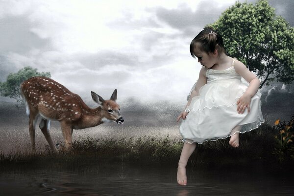 A little girl in a white dress and a deer