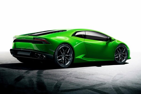 Green lamborghini on the background of a frozen road