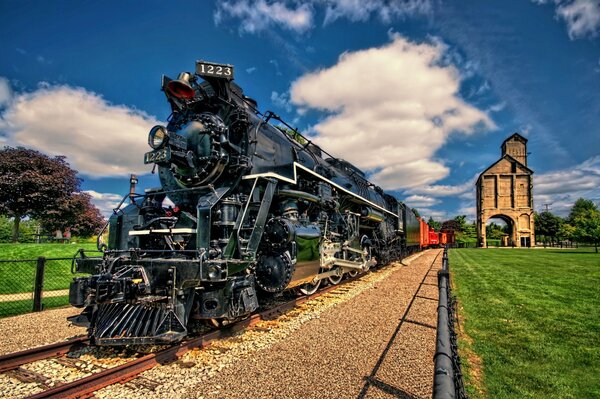 Realistic mock-up of a locomotive on a background of clouds