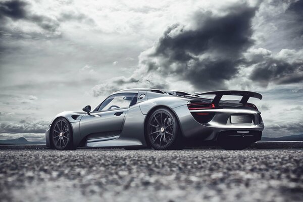 Silver car thunderstorm dark sky