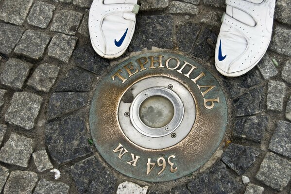 Nikes on paving stones city of Ternopil