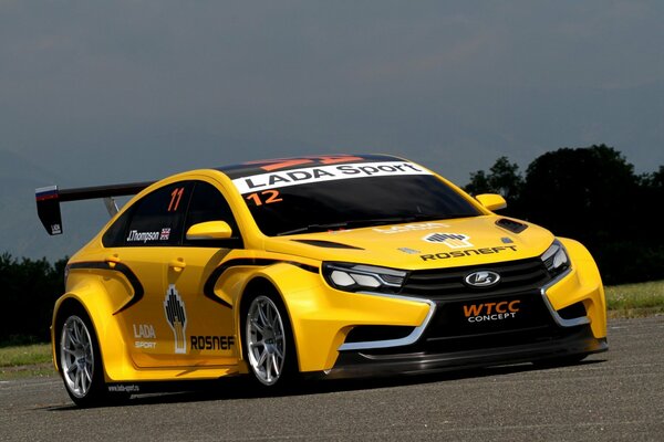 Yellow sports car on the road