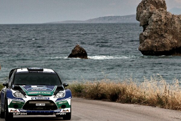 Racing car on the track by the sea