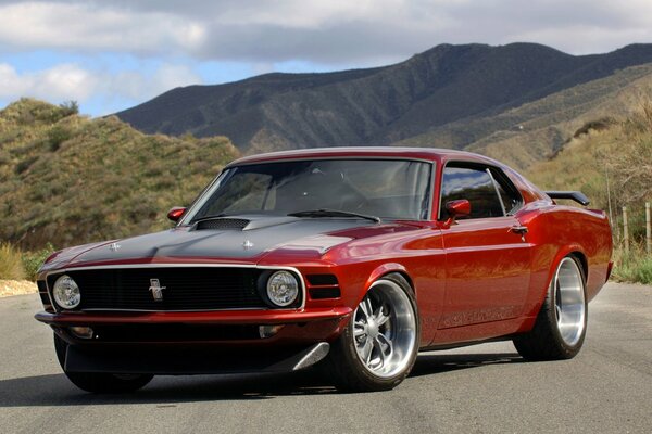 Ford mustang on the road in the mountains