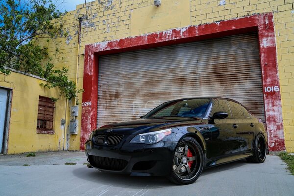 Black bmw at the garage door