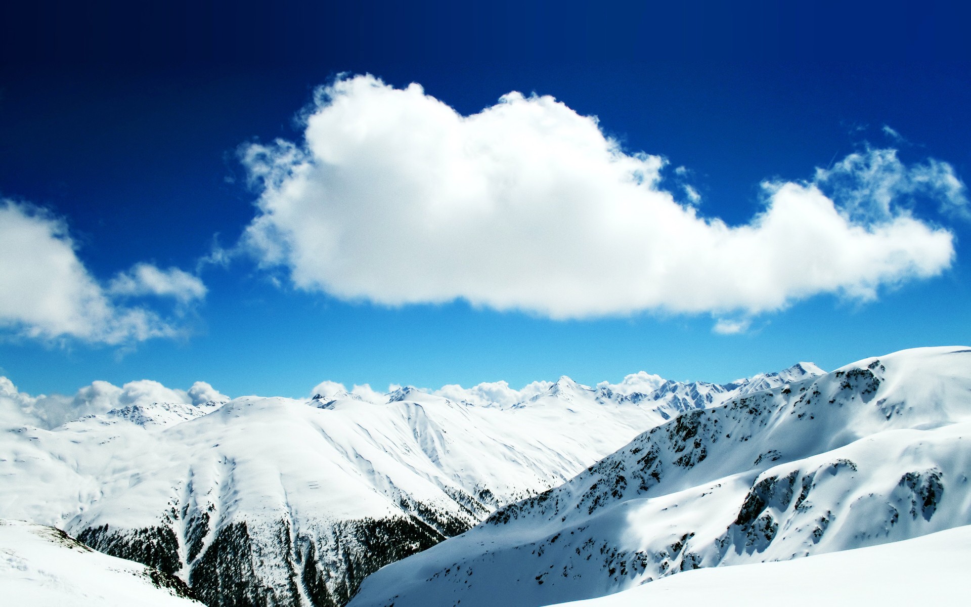 mountain tops snow cloud