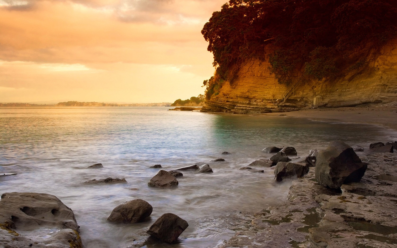 unset beach auckland new zealand