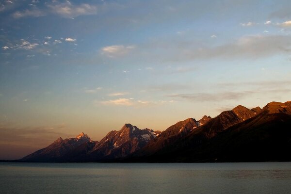 Sunset in the mountains on the background of the sea