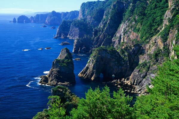 Mountains near the shore of the blue sea