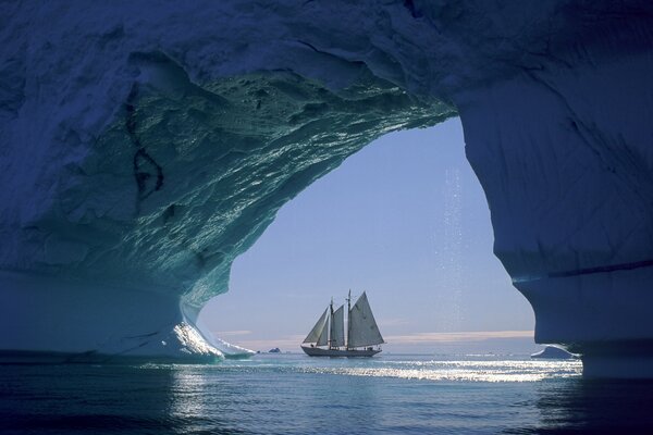 Sailboat near the glacier in the sea