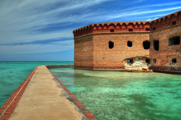 A bridge in the middle of the sea in ruins