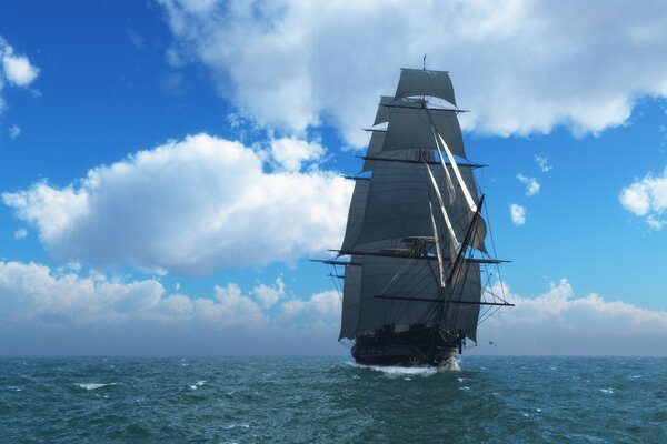 A ship with sails in the sea against the background of clouds