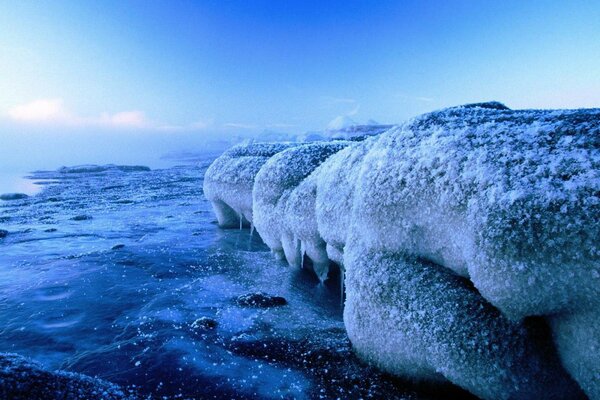 Harsh northern landscape - the edge of an iceberg against the sea