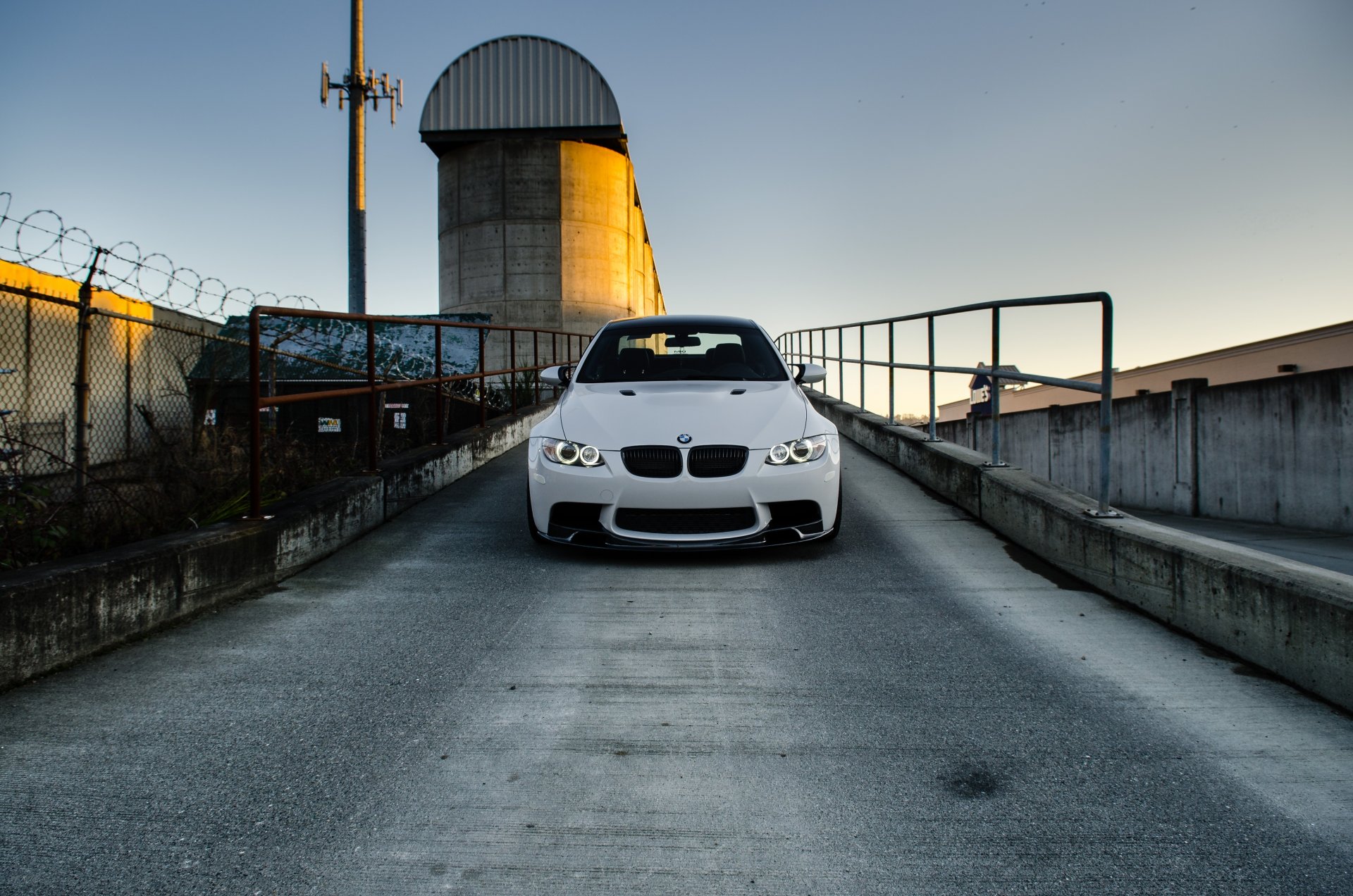 bmw m3 e92 white bmw front end fence barbed wire sky