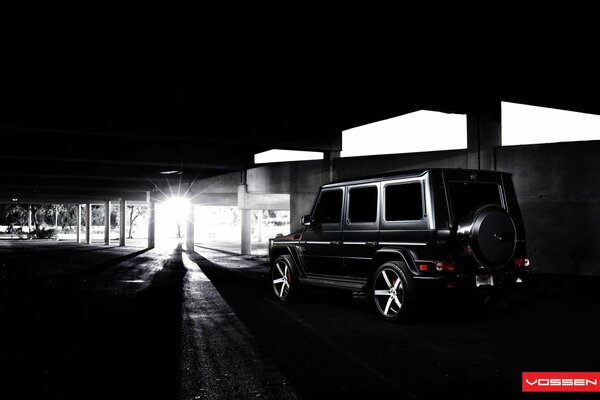 A gangster car in the parking lot in black and white