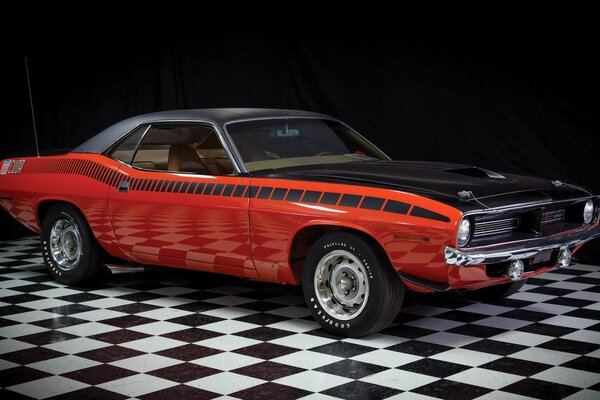 Red muscle car on the chess floor