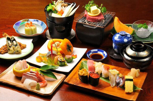 A large set of various Japanese dishes