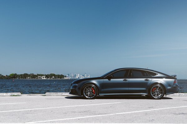 Audi in the parking lot, against the background of the sea