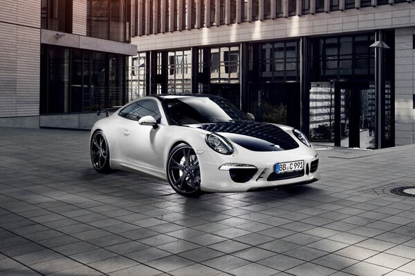 Black and white Porsche in the courtyard of the metropolis