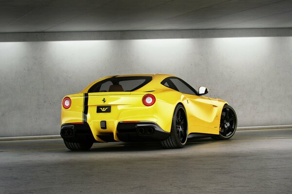 Rear view of a yellow ferrari f12 berlinetta