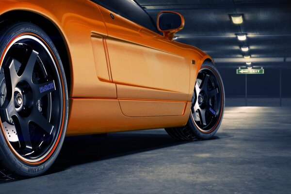 Honda NSX orange in the parking lot