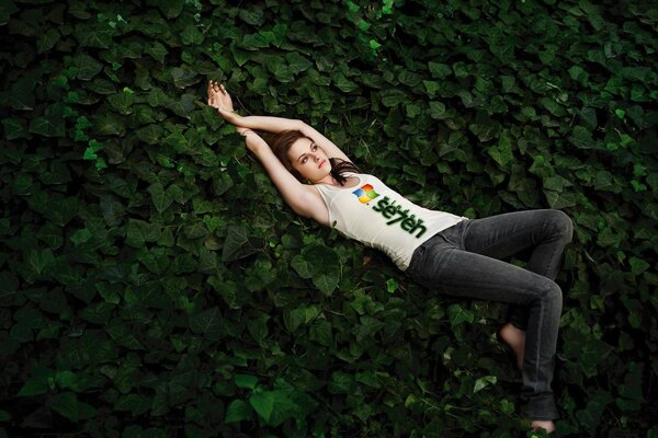 A picture of a girl lying in the forest