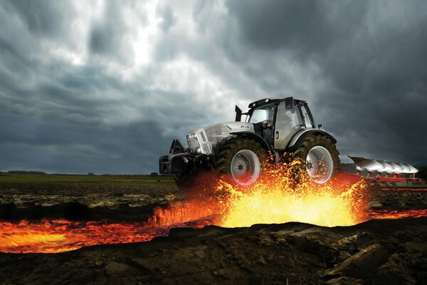 The tractor is plowing and there is lava around