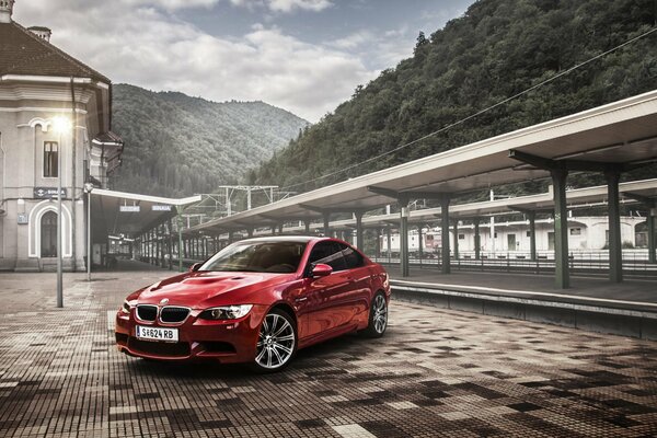 Beautiful red car on the background of mountains