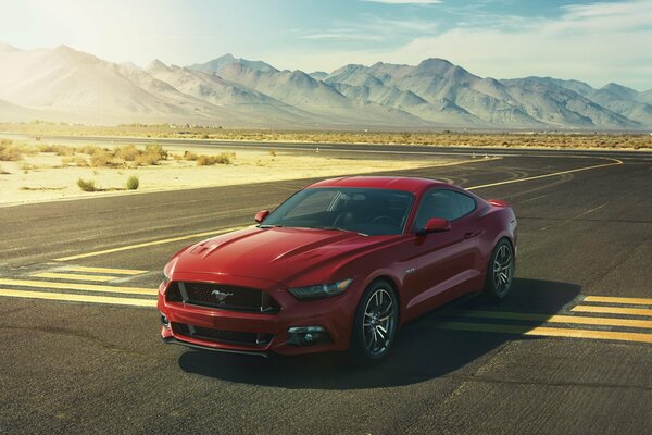 Ford Mustang on the background of a mountain landscape