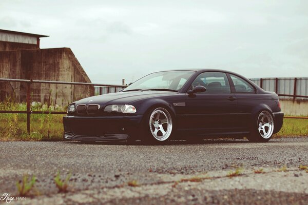 Black tuned BMW on the road in