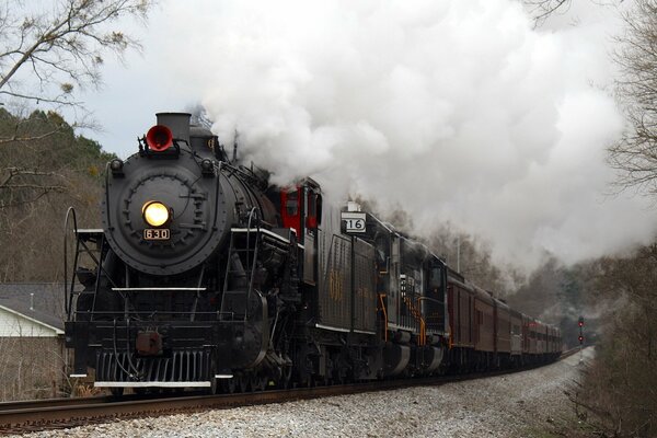 An old train blowing smoke