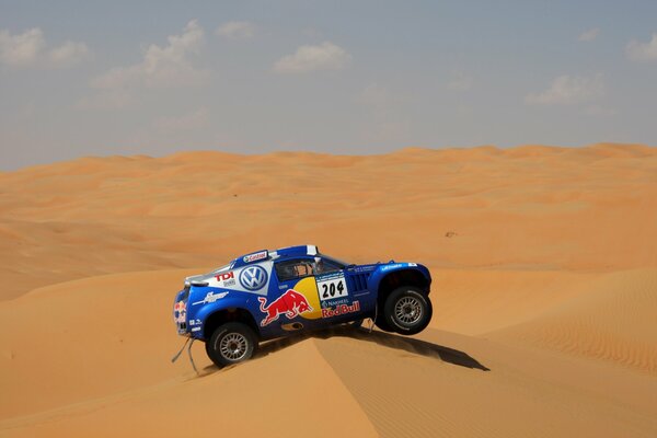 A blue Volkswagen car in the desert