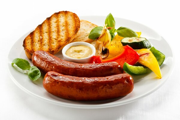 English breakfast with toast, sausages and vegetables