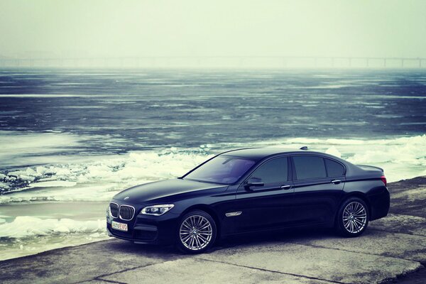 BMW car on the shore