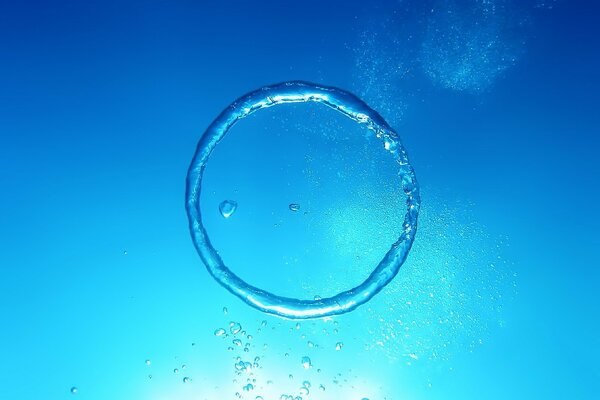 A circle of water on a blue background