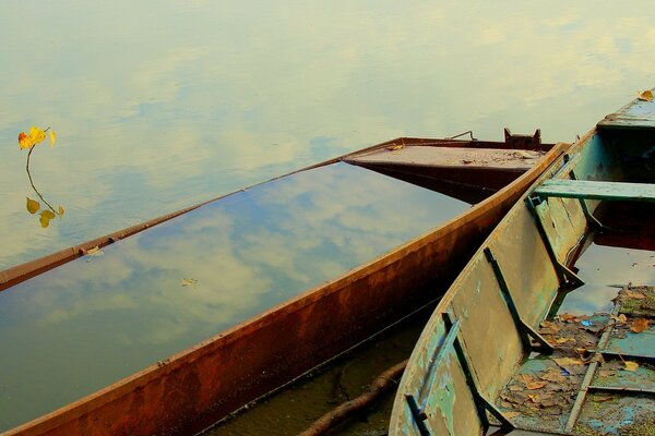 Two old boats on the water