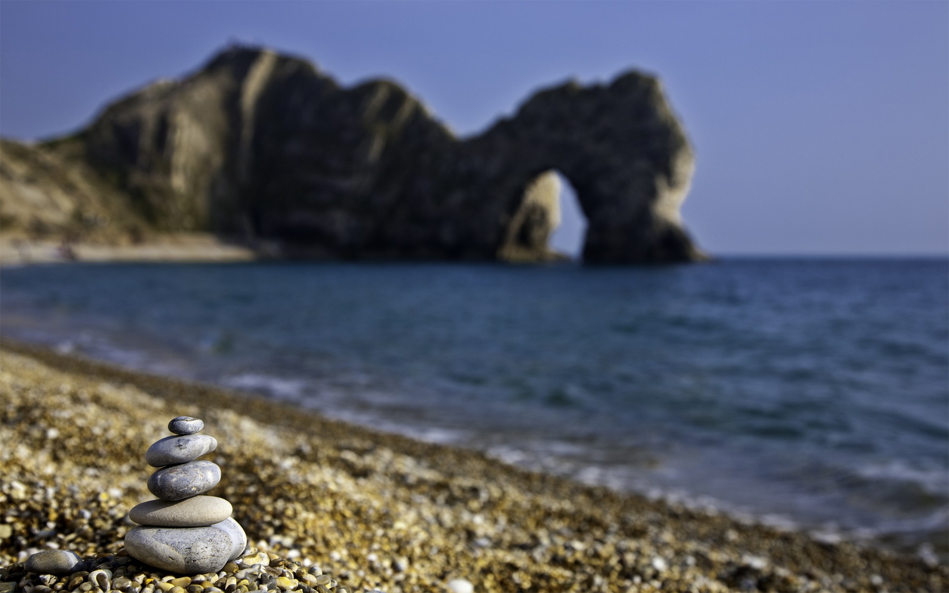 tones beach grotto sea pebbles england