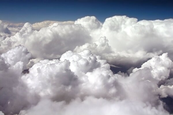 Cumulus clouds. Flying over the world