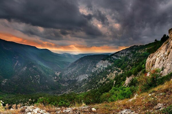 Landscapes of the Crimean mountains with lead clouds