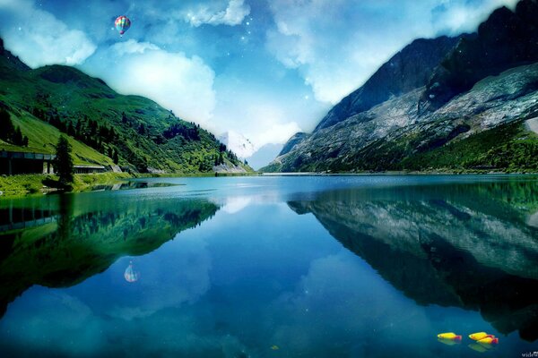 Mountains are reflected in the blue water of the lake