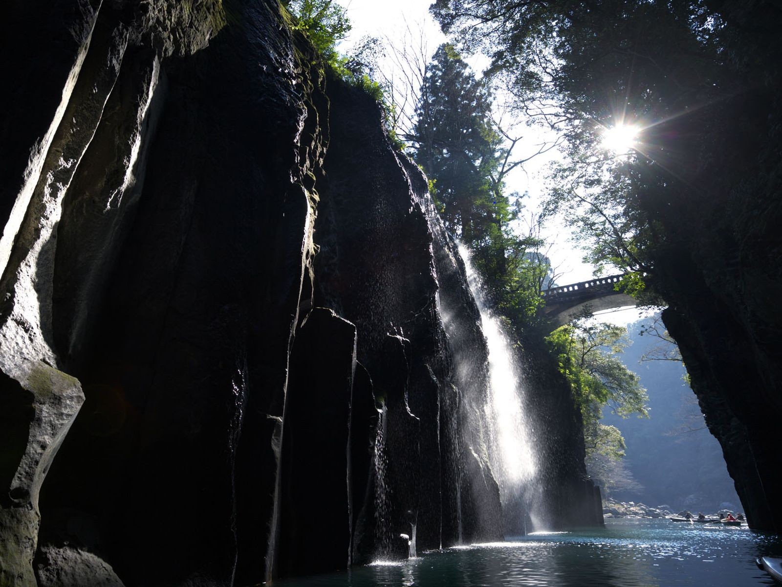 bridge valley sun waterfall river boat rock tree