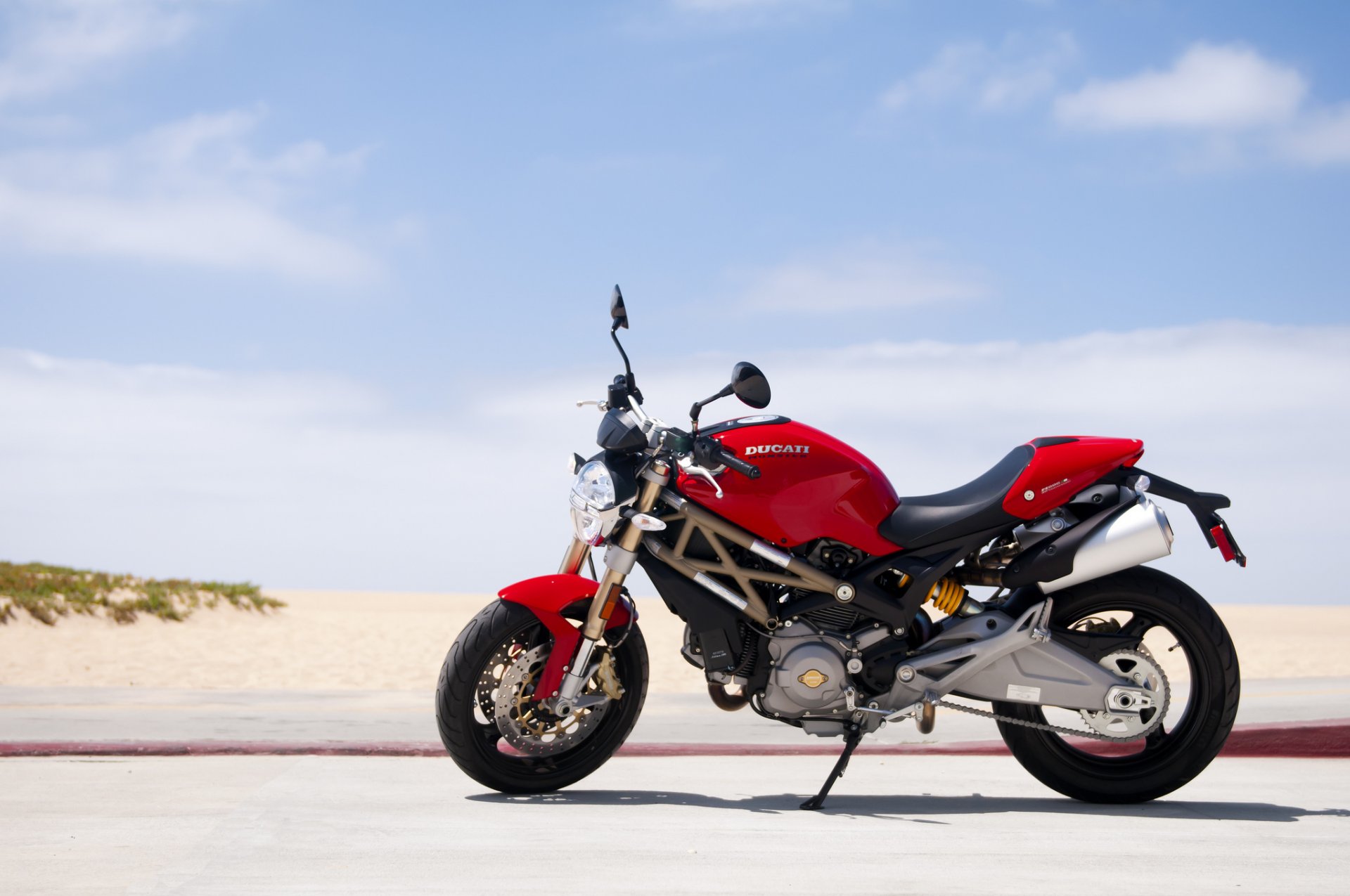 ducati monster red sky road beach